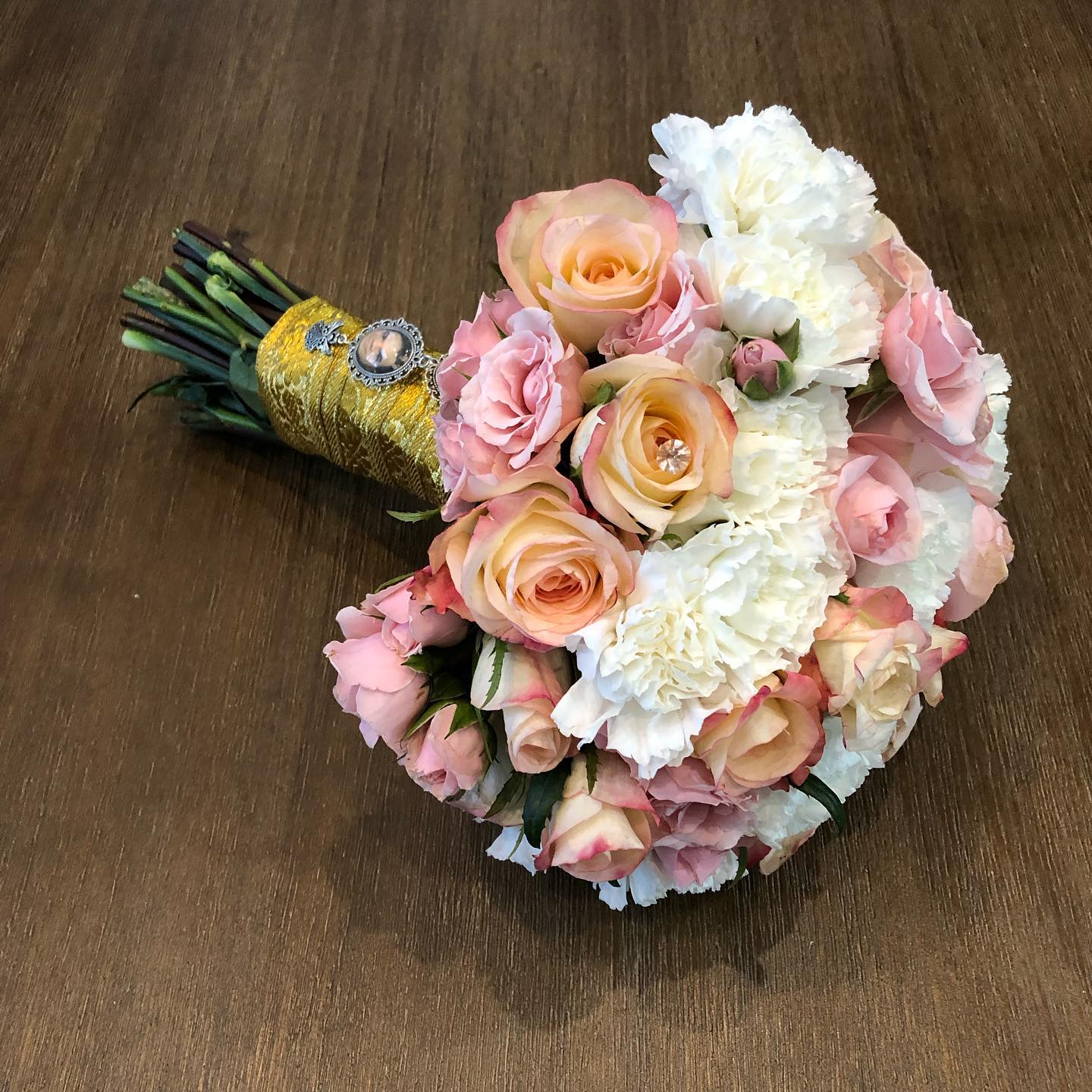 Blush bridal bouquet with gold wrap